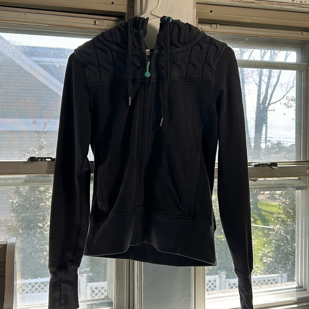 Teal and grey Lululemon hoodie.